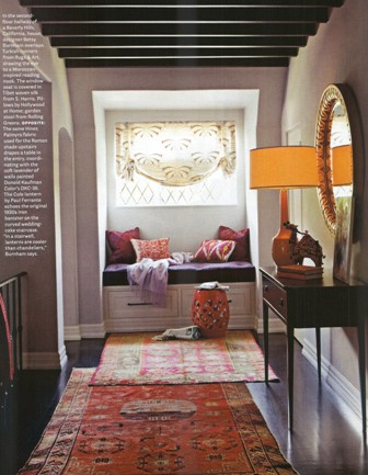 Turkish runners, arched doorway, wooden beams and bright colors creat a Moroccan themed reading nook