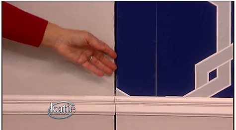 Katie points out a crack in wallpaper installation_casartblog